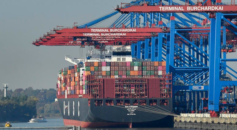 container ship is loaded at the harbor in Hamburg, Germany container ship is loaded at the harbor in Hamburg, Germany