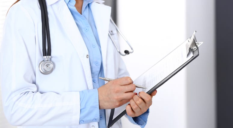 doctor with clipboard doctor with clipboard