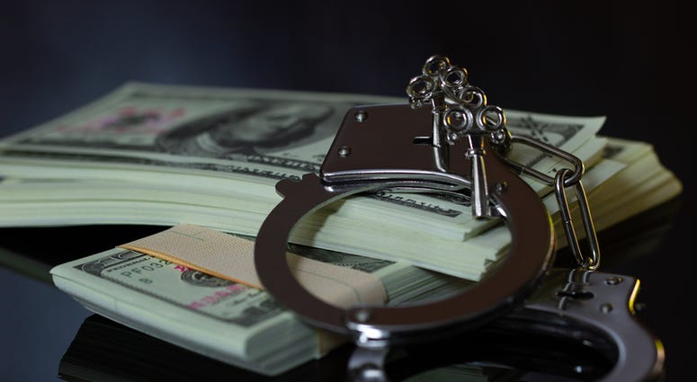 handcuffs and money handcuffs and money