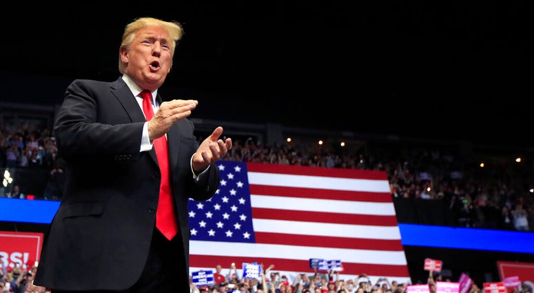President Donald Trump arrives to speak at a rally in Grand Rapids, Mich., President Donald Trump arrives to speak at a rally in Grand Rapids, Mich.,