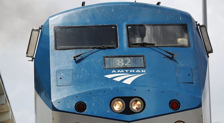 Woman narrowly escapes death as SUV is hit by train