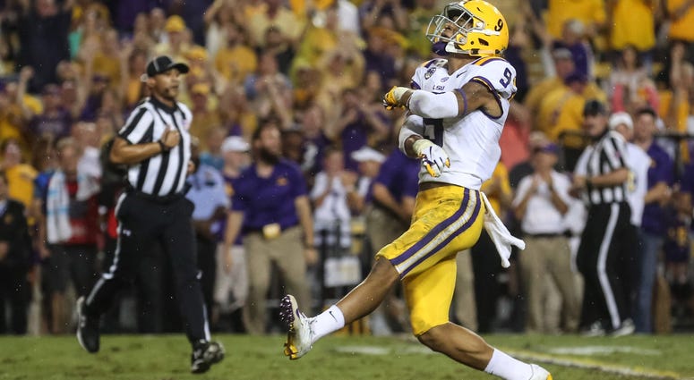 Sep 29, 2018; Baton Rouge, LA, USA; LSU Tigers safety Grant Delpit (9) celebrates after sacking Mississippi Rebels quarterback Jordan Ta'amu (not pictured) during the first quarter of a game at Tiger Stadium.