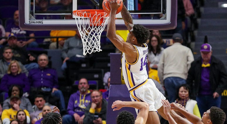 Jan 21, 2020; Baton Rouge, Louisiana, USA; LSU Tigers guard Marlon Taylor (14) misses a dunk against Florida Gators guard Andrew Nembhard (2) during the second half at Maravich Assembly Center. LSU