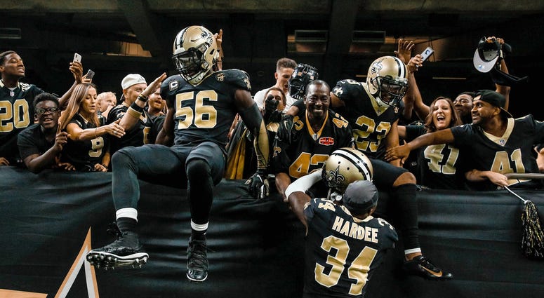 Sep 16, 2018; New Orleans, LA, USA; New Orleans Saints linebacker Demario Davis (56) and cornerback Marshon Lattimore (23) and cornerback Justin Hardee (34) celebrate with fans in the stands after a missed field goal by Cleveland Browns place kicker Zane Sep 16, 2018; New Orleans, LA, USA; New Orleans Saints linebacker Demario Davis (56) and cornerback Marshon Lattimore (23) and cornerback Justin Hardee (34) celebrate with fans in the stands after a missed field goal by Cleveland Browns place kicker Zane