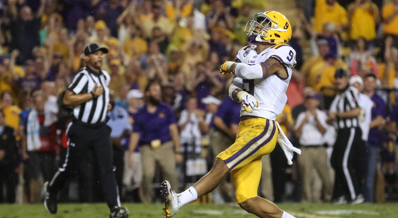 LSU Tigers safety Grant Delpit (9) celebrates after sacking Mississippi Rebels quarterback Jordan Ta'amu (not pictured) during the first quarter of a game at Tiger Stadium.