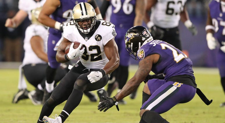 New Orleans Saints tight end Ben Watson (82) gains yards after the catch defended by Baltimore Ravens safety Tony Jefferson (23) at M&T Bank Stadium.