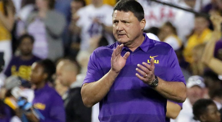 Nov 3, 2018; Baton Rouge, LA, USA; LSU Tigers head coach Ed Orgeron cheers on his players during warmup drills before their game against the Alabama Crimson Tide at Tiger Stadium. Nov 3, 2018; Baton Rouge, LA, USA; LSU Tigers head coach Ed Orgeron cheers on his players during warmup drills before their game against the Alabama Crimson Tide at Tiger Stadium.