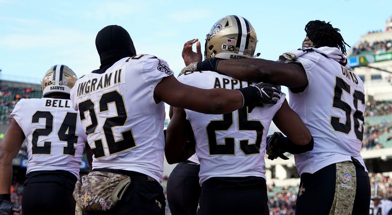 Nov 11, 2018; Cincinnati, OH, USA; New Orleans Saints cornerback Eli Apple (25) celebrates with teammates running back Mark Ingram (22) and outside linebacker Demario Davis (56) after intercepting a pass against the Cincinnati Bengals in the second half a Nov 11, 2018; Cincinnati, OH, USA; New Orleans Saints cornerback Eli Apple (25) celebrates with teammates running back Mark Ingram (22) and outside linebacker Demario Davis (56) after intercepting a pass against the Cincinnati Bengals in the second half a