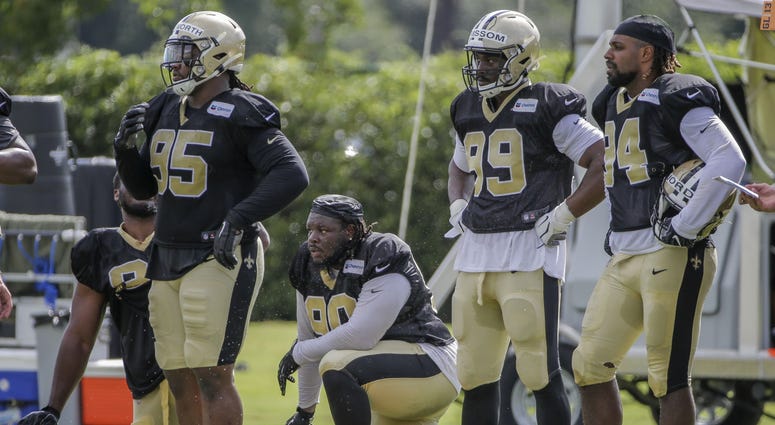 Jul 28, 2019; Metairie, LA, USA; New Orleans Saints defensive tackle Taylor Stallworth (95) and defensive tackle Malcom Brown (90) and defensive end Geneo Grissom (99) and defensive end Cameron Jordan (94) look on during training camp at the Ochsner Sport Jul 28, 2019; Metairie, LA, USA; New Orleans Saints defensive tackle Taylor Stallworth (95) and defensive tackle Malcom Brown (90) and defensive end Geneo Grissom (99) and defensive end Cameron Jordan (94) look on during training camp at the Ochsner Sport