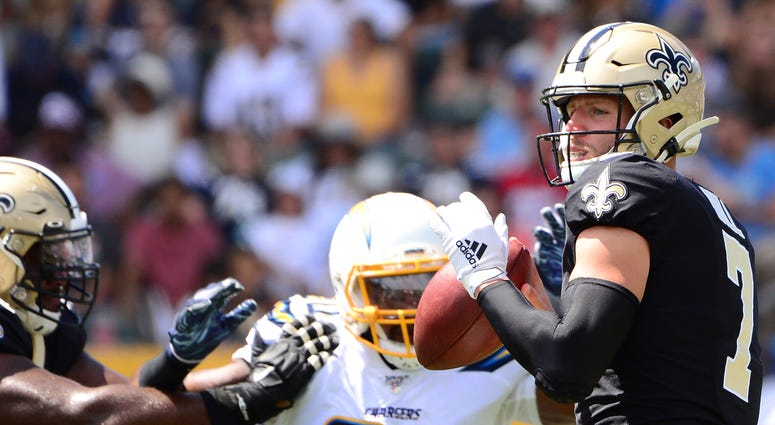 New Orleans Saints quarterback Taysom Hill (7) looks to pass during the second quarter against the Los Angeles Chargers at Dignity Health Sports Park.