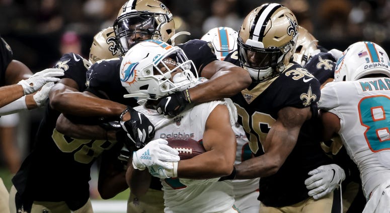 Aug 29, 2019; New Orleans, LA, USA; New Orleans Saints linebacker Darnell Sankey (44) and defensive back T.J. Green (36) tackle Miami Dolphins running back Myles Gaskin (37) during the second half of a preseason game at the Mercedes-Benz Superdome. Aug 29, 2019; New Orleans, LA, USA; New Orleans Saints linebacker Darnell Sankey (44) and defensive back T.J. Green (36) tackle Miami Dolphins running back Myles Gaskin (37) during the second half of a preseason game at the Mercedes-Benz Superdome.