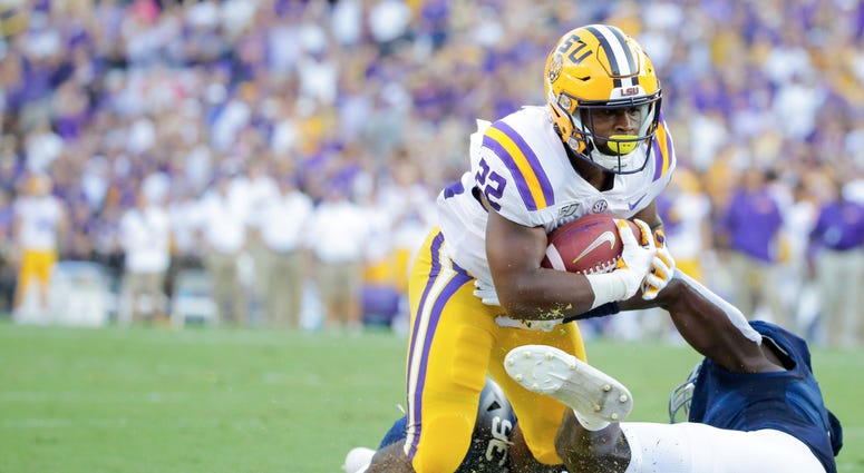 LSU Tigers running back Clyde Edwards-Helaire (22) runs against the Georgia Southern Eagles during the first quarter at Tiger Stadium.