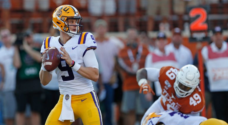 LSU Tigers quarterback Joe Burrow (9) looks to pass against the Texas Longhorns in the first half at Darrell K Royal-Texas Memorial Stadium.