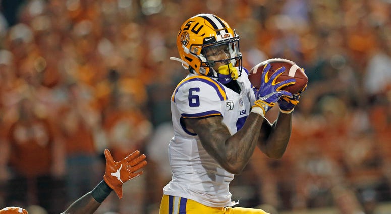 LSU Tigers wide receiver Terrace Marshall Jr. (6) makes a touchdown reception against the Texas Longhorns in the second half at Darrell K Royal-Texas Memorial Stadium.