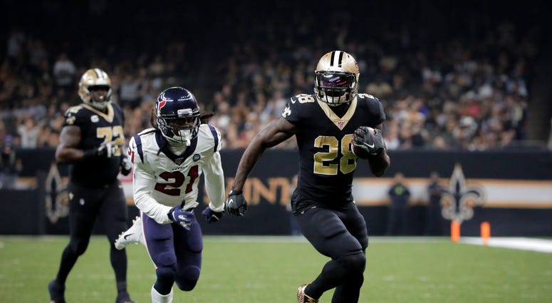 New Orleans Saints running back Latavius Murray (28) runs for a touchdown past Houston Texans cornerback Bradley Roby (21) during the third quarter at the Mercedes-Benz Superdome.