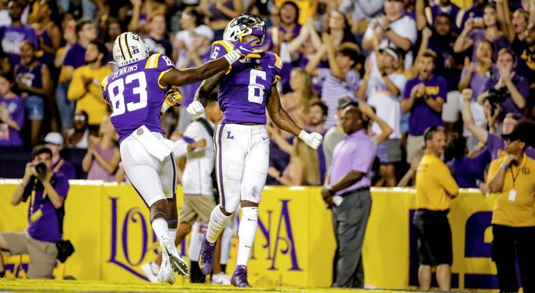 LSU Tigers wide receiver Terrace Marshall Jr. (6) celebrates with wide receiver Jaray Jenkins (83) after a touchdown catch against the Northwestern State Demons during the second quarter at Tiger Stadium.