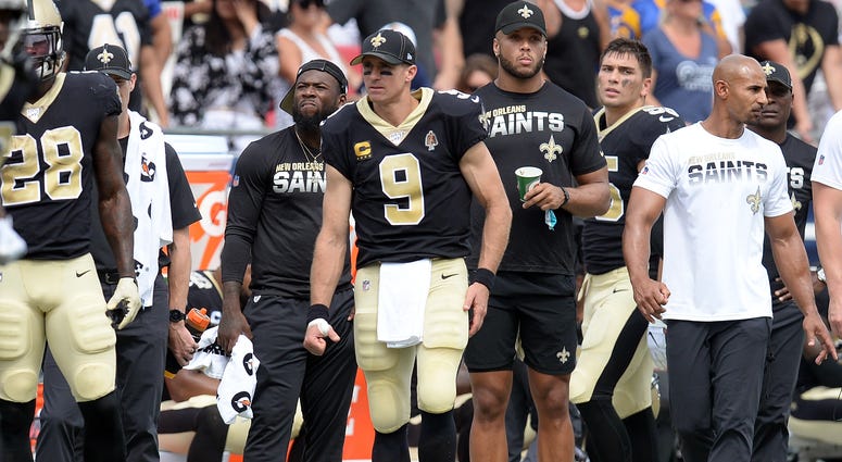 New Orleans Saints quarterback Drew Brees (9) watches game action against the Los Angeles Rams during the first half at Los Angeles Memorial Coliseum.