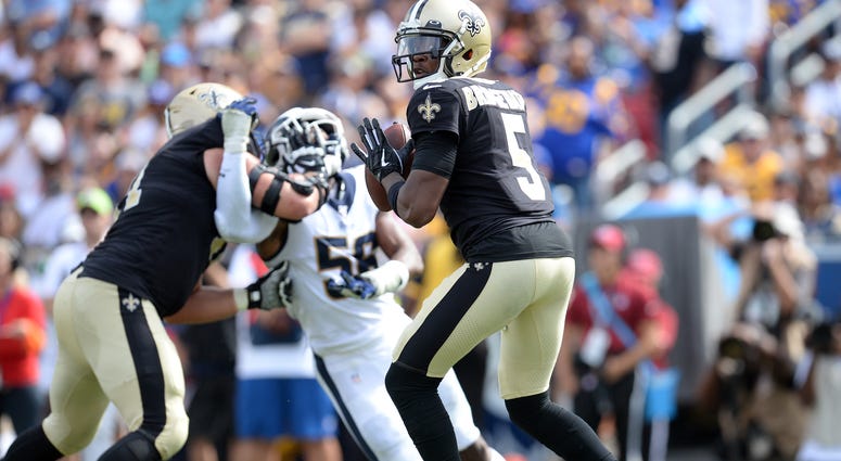 New Orleans Saints quarterback Teddy Bridgewater (5) drops back to pass against the Los Angeles Rams during the second half at Los Angeles Memorial Coliseum.