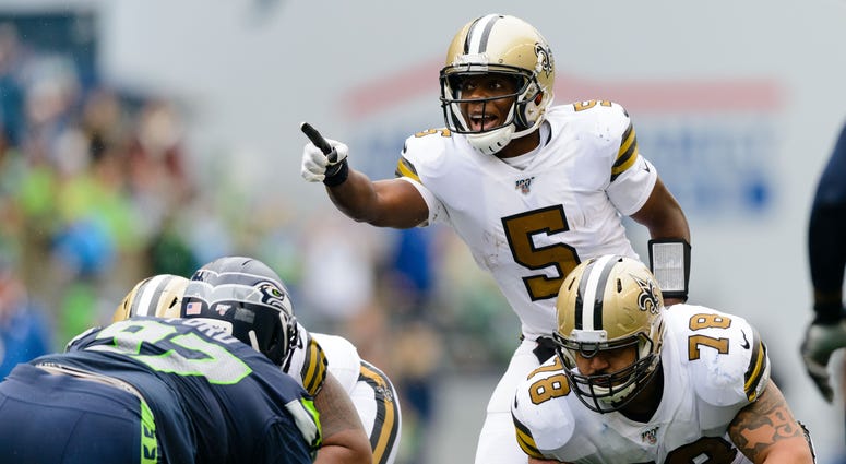 New Orleans Saints quarterback Teddy Bridgewater (5) points to the Seattle Seahawks defense during the second half at CenturyLink Field.
