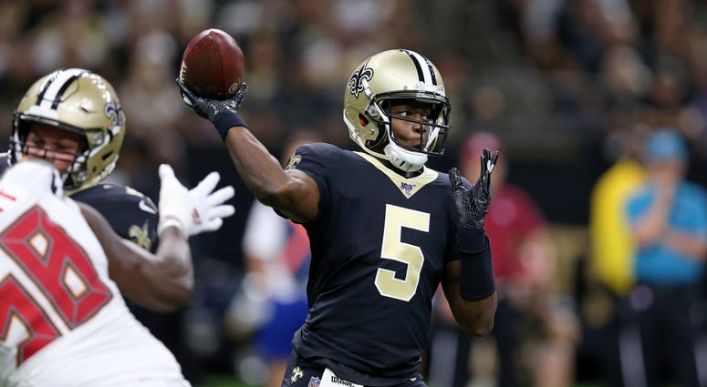 New Orleans Saints quarterback Teddy Bridgewater (5) makes a throw against the Tampa Bay Buccaneers in the first quarter at the Mercedes-Benz Superdome.