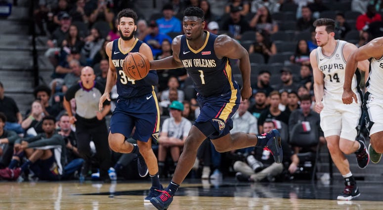 New Orleans Pelicans forward Zion Williamson (1) brings the ball up the court against the San Antonio Spurs at the AT&T Center.