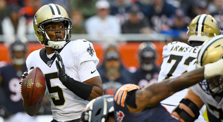 New Orleans Saints quarterback Teddy Bridgewater (5) drops back to a pass against the Chicago Bears during the first half at Soldier Field.