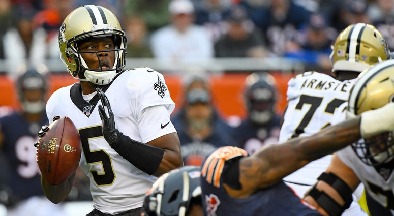 New Orleans Saints quarterback Teddy Bridgewater (5) drops back to a pass against the Chicago Bears during the first half at Soldier Field.
