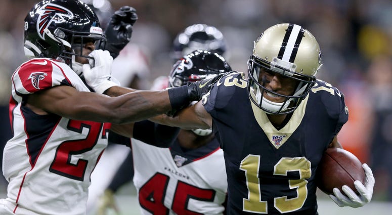 New Orleans Saints wide receiver Michael Thomas (13) pushes Atlanta Falcons strong safety Damontae Kazee (27) away by his facemark in the second quarter at the Mercedes-Benz Superdome. Thomas was called for a facemark penalty.
