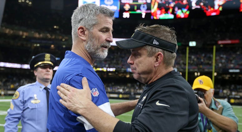 Indianapolis Colts head coach Frank Reich talks to New Orleans Saints head coach Sean Payton after their game at the Mercedes-Benz Superdome
