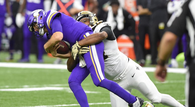 New Orleans Saints defensive end Cameron Jordan (94) sacks Minnesota Vikings quarterback Kirk Cousins (8) during the fourth quarter of a NFC Wild Card playoff football game at the Mercedes-Benz Superdome.