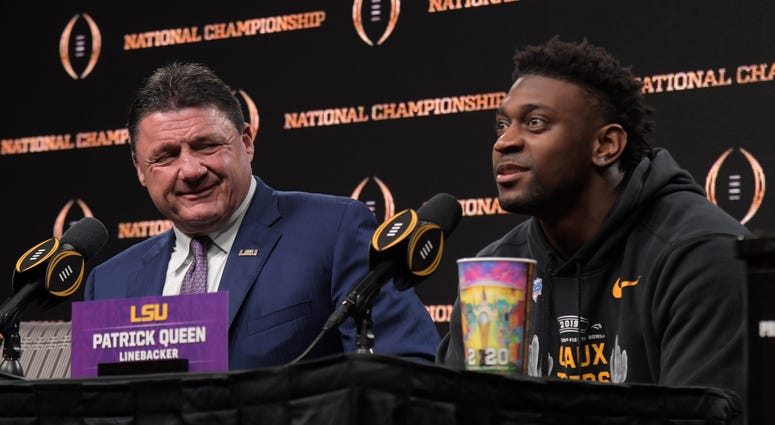 LSU Tigers coach Ed Orgeron (left) and linebacker Patrick Queen during the CFP National Championship champions press conference at the Sheraton New Orleans. LSU defeated Clemson 42-25.