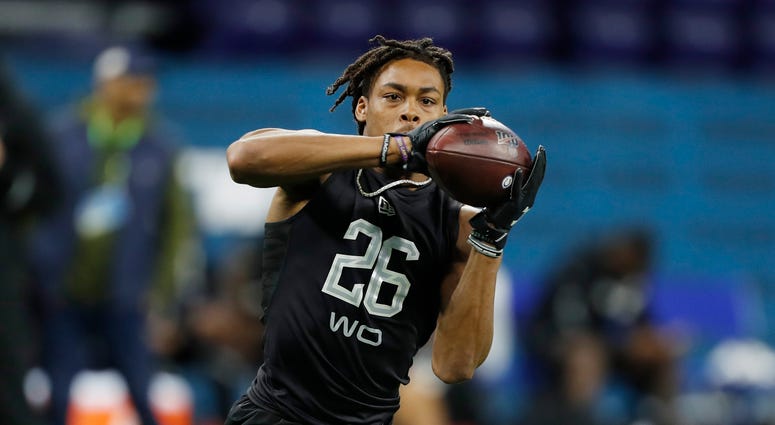 Louisiana State Tigers wide receiver Justin Jefferson (WO26) catches a pass during a workout drill during the 2020 NFL Combine at Lucas Oil Stadium.
