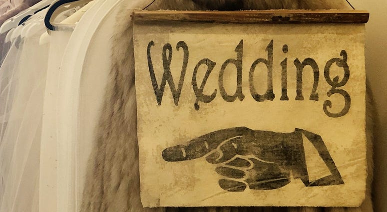 A New Orleans couple said "I do" on their front porch Saturday