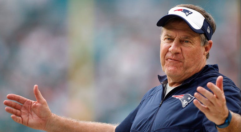 New England Patriots head coach Bill Bellichick coach gestures between plays in the second half against the Miami Dolphins at Sun Life Stadium. The Dolphins defeated the Patriots 20-10.