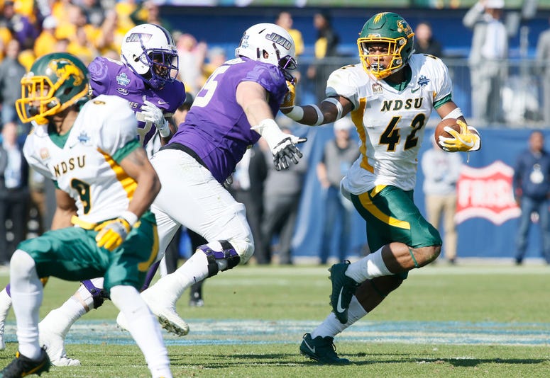 North Dakota State Bison linebacker Jabril Cox (42) is tackled by James Madison Dukes offensive lineman Nick Edwards (55) after picking up a fumble in the second quarter at Toyota Stadium.