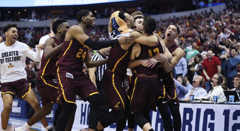 Mar 17, 2018; Dallas, TX, USA; Loyola (Il) Ramblers guard Clayton Custer (13) celebrates with teammates after hitting the game-winning shot to defeat the Tennessee Volunteers in the second round of the 2018 NCAA Tournament at American Airlines Center. Mar 17, 2018; Dallas, TX, USA; Loyola (Il) Ramblers guard Clayton Custer (13) celebrates with teammates after hitting the game-winning shot to defeat the Tennessee Volunteers in the second round of the 2018 NCAA Tournament at American Airlines Center.