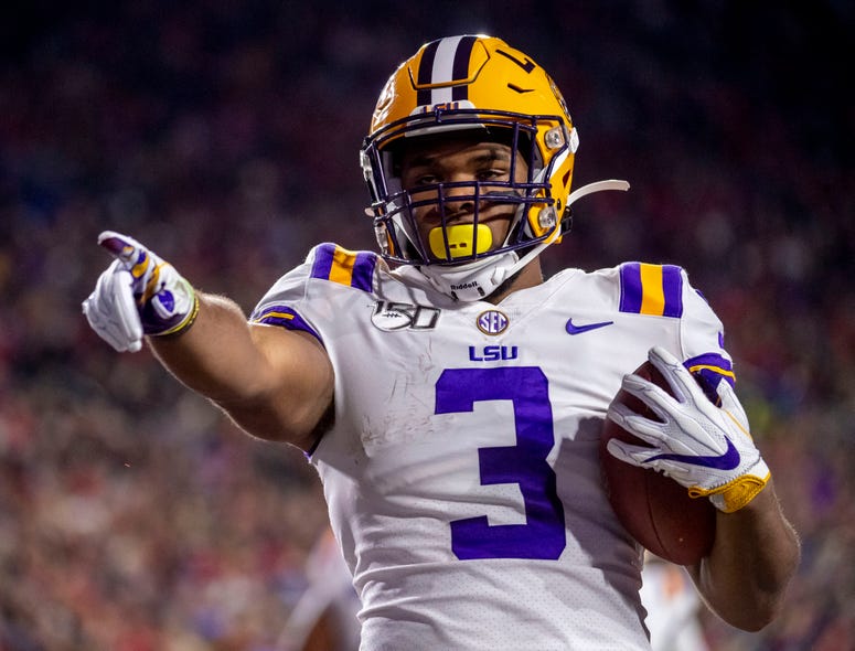 Louisiana State Tigers running back Tyrion Davis-Price (3) salutes the fans after he ran in for a touchdown during the first quarter against the Mississippi Rebels at Vaught-Hemingway Stadium.