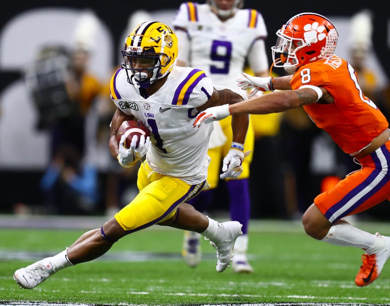 Clemson Tigers receiver Ja'Marr Chase (1) runs after a reception against the LSU Tigers in the College Football Playoff national championship game at Mercedes-Benz Superdome.