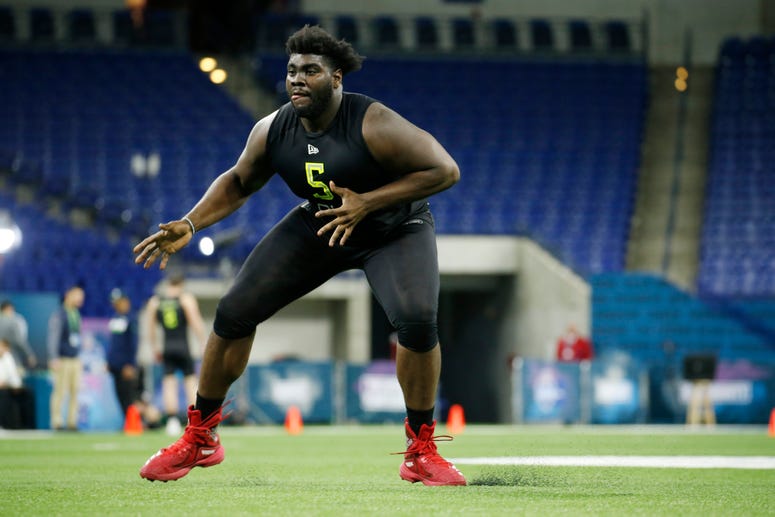 Louisville Cardinals offensive lineman Mekhi Becton (OL05) goes through workout drills during the 2020 NFL Combine at Lucas Oil Stadium.