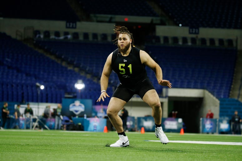 Alabama Crimson Tide offensive lineman Jedrick Wills (OL51) goes through a workout drill during the 2020 NFL Combine at Lucas Oil Stadium.