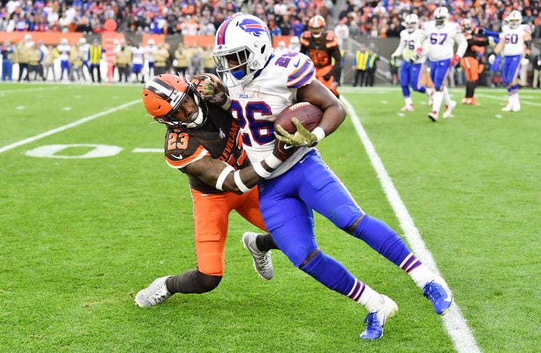 Cleveland Browns free safety Damarious Randall (23) tackles Buffalo Bills running back Devin Singletary (26) during the second half at FirstEnergy Stadium.