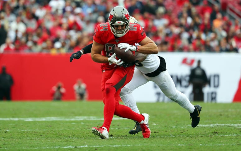 Tampa Bay Buccaneers tight end Cameron Brate (84) catches the ball over New Orleans Saints cornerback Eli Apple (25) during the second half at Raymond James Stadium.