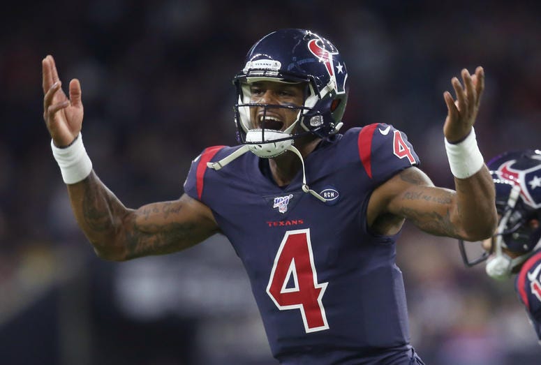 Houston Texans quarterback Deshaun Watson (4) celebrates after throwing a touchdown against the New England Patriots in the second half at NRG Stadium.