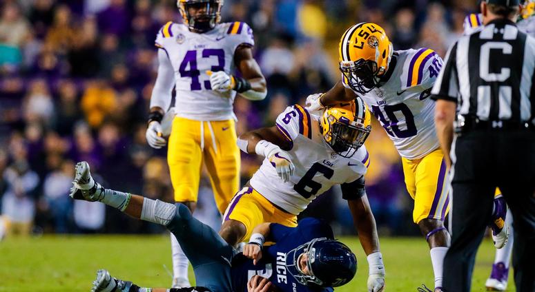Nov 17, 2018; Baton Rouge, LA, USA; Rice Owls quarterback Shawn Stankavage (3) is sacked by LSU Tigers linebacker Jacob Phillips (6) in the first half at Tiger Stadium.