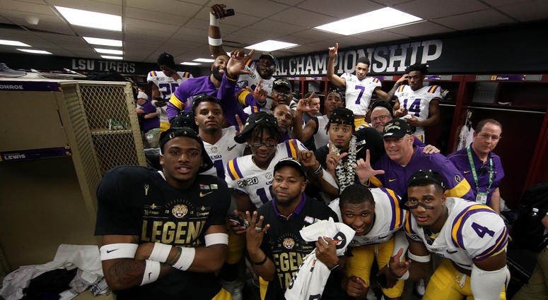 NEW ORLEANS, LOUISIANA - JANUARY 13: LSU Tigers celebrates in the locker room after defeating the Clemson Tigers 42-25 in the College Football Playoff National Championship game at Mercedes Benz Superdome. LSU
