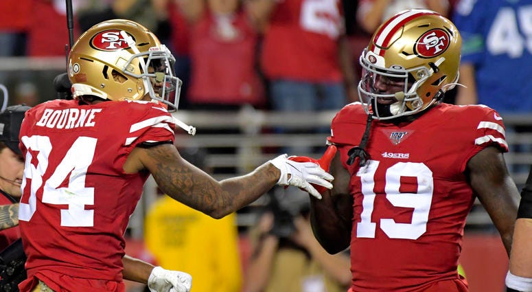 San Francisco 49ers wide receiver Kendrick Bourne (left) celebrates his touchdown next to 49ers wide receiver Deebo Samuel (right) during the first half against the Seattle Seahawks at Levi's Stadium.