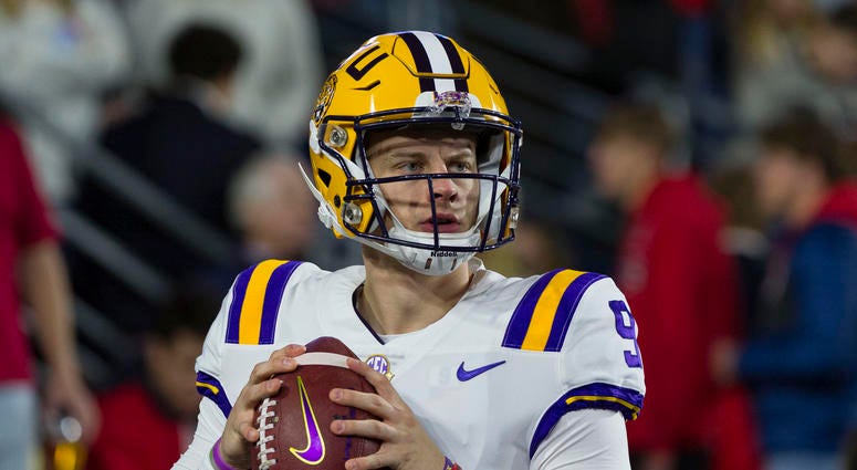 LSU Tigers quarterback Joe Burrow (9) warms up before the game against the Mississippi Rebels at Vaught-Hemingway Stadium.