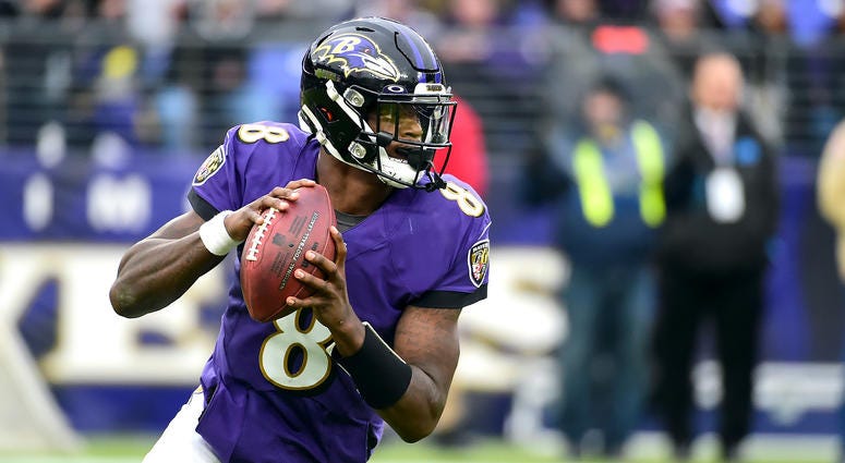 Baltimore Ravens quarterback Lamar Jackson (8) looks to throw in the fourth quarter against the Houston Texans at M&T Bank Stadium.
