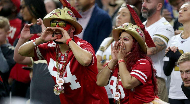 A San Francisco 49ers fans yell from the stands during the second quarter in the 49ers game against the New Orleans Saints at the Mercedes-Benz Superdome.