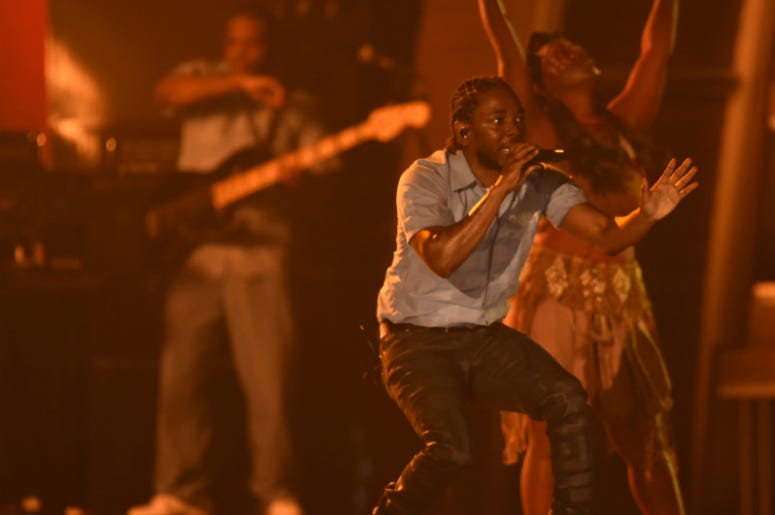 Kendrick Lamar performs during the 58th Grammy Awards at the Staples Center. Kendrick Lamar performs during the 58th Grammy Awards at the Staples Center.